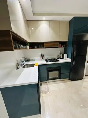 a kitchen with a sink and a refrigerator at Studio Al Amir 12 CFC à 2mn in Casablanca