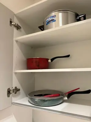 a kitchen shelf with a pan and a pot on it at Little paradis Casablanca in Casablanca