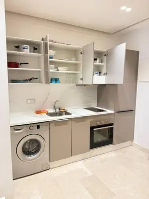 a kitchen with a sink and a washing machine at Little paradis Casablanca in Casablanca