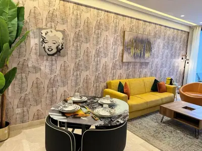 a living room with a couch and a table at Little paradis Casablanca in Casablanca