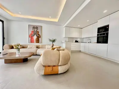 a large living room with a couch and a table at Appartement Luxueux Spacieux & une Vue Panoramique in Casablanca
