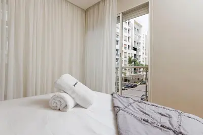 a hotel room with a bed with towels on it at Elegant 2BR in Hay Riad - New Furnishings & Design in Beni Brour