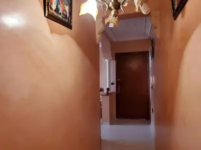 a hallway with a door and a room with a ceiling at à 10 minutes du grand mall d'Afrique, WiFi Netflix 1ère étage in Oulad Hamida