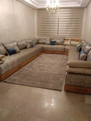 a living room with a large couch in a room at Appartement in Casablanca