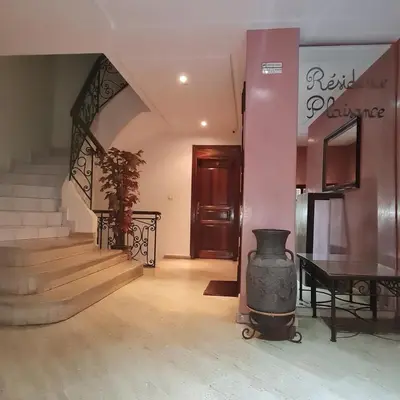 a room with a staircase and a stove in it at Appartement confortable et bien situé in Casablanca