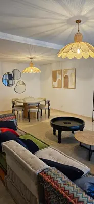 a living room with couches and ping pong tables at le carrousel Rabat Océan in Kouas