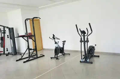 a gym with several exercise bikes in a room at Chic & Charme Studio Près de l'aéroport in Nouaceur