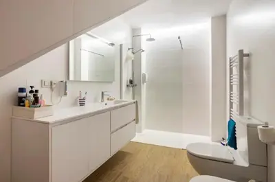 a white bathroom with a sink and a toilet at Maison du bonheur in Casablanca