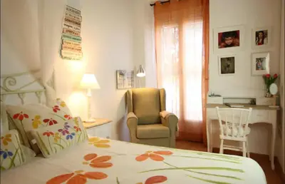 a bedroom with a bed and a desk and a chair at Maison du bonheur in Casablanca