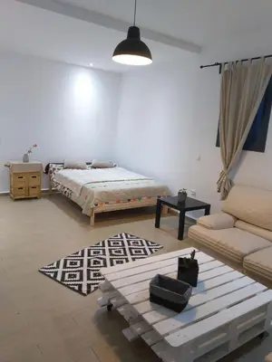 a living room with a bed and a couch at Sweet Home in Casablanca