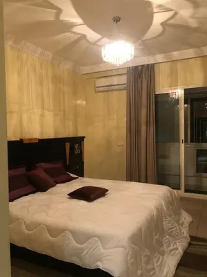 a bedroom with a large white bed with a ceiling at Casablanca in Casablanca