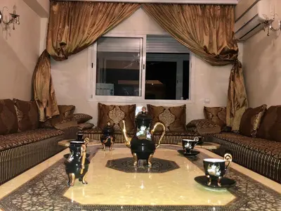 a living room with a table with vases on it at Casablanca in Casablanca