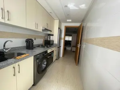 a kitchen with a washing machine and a washer at Bel appartement in Casablanca
