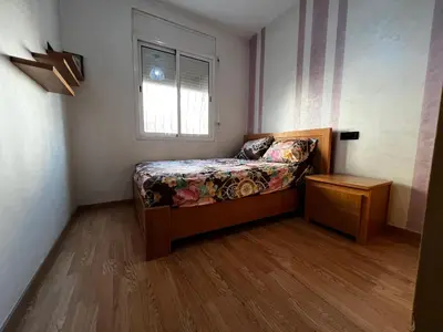 a small bedroom with a bed and a window at Appartement à 5min de Casanearshore in Casablanca