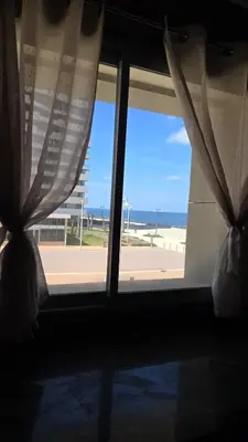 a window with a view of the beach from a room at Marina in Casablanca