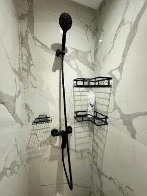 a shower with a blow dryer in a bathroom at Alonso studio au coeur de Maarif in Casablanca