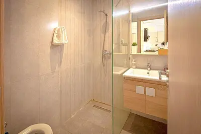 a bathroom with a shower and a sink and a toilet at Joli cocon en plein centre a10 min a pieds de la corniche in Casablanca