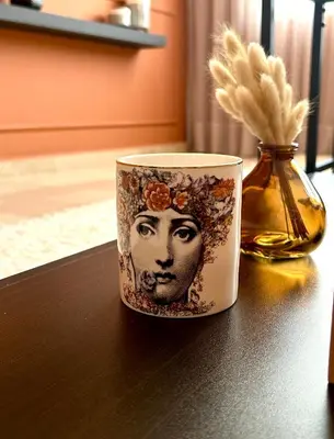 a cup with a face on it sitting on a table at The 23 Princesses by IB Signature - Stylish 2 Bedroom Apt with Wifi, Self check-in - 24 x7 Security - City View - Walk to Cafes! City Centre in Casablanca