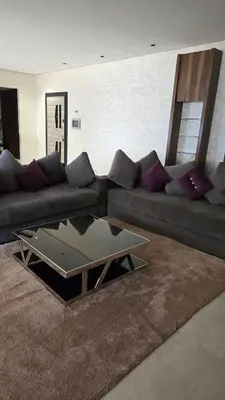 a living room with a couch and a coffee table at Marina casablanca in Casablanca