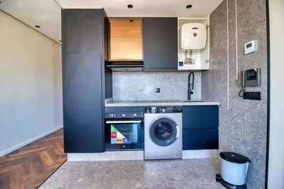 a kitchen with a washing machine and a washer at Prestigieux Studio- Vue dégagée in Casablanca