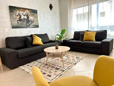a living room with two couches and a table at Perfect for Families & Friends! King & Queen beds in Casablanca