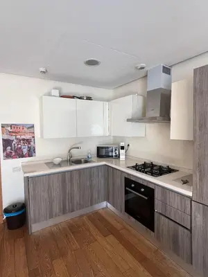 a kitchen with a sink and a stove top oven at Oean view apartment Marina Casablanca in Casablanca