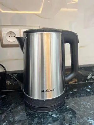 a metal coffee pot sitting on a counter at Cozy appartement Rabat in Rabat