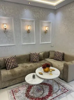 a living room with a couch and a table at Cozy appartement Rabat in Rabat