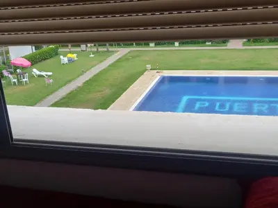 a view of a swimming pool from a window at Puerto banus beach Apt Famillies and married couples in Mansouria