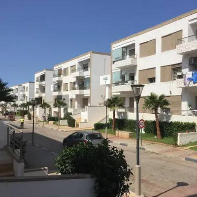 a car parked in front of a large apartment building at Puerto banus beach Apt Famillies and married couples in Mansouria