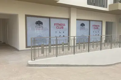 a building with four windows with the words fitness club at Studio Meuble a 5 min de l'aéroport Casablanca in Nouaceur