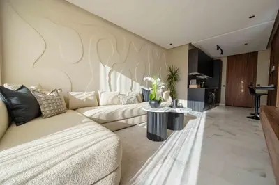 a living room with a couch and a table at Luxe Modern Studio in Casablanca in Casablanca