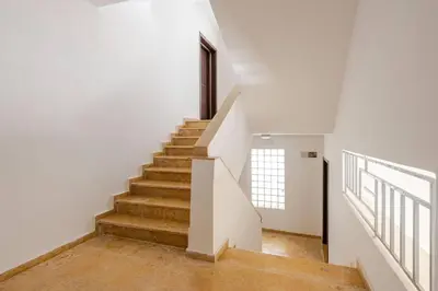 a staircase in a house with white walls and wooden floors at New! Appartement les pieds dans l'eau WELCOME STAY in Pont Blondin