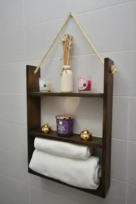 a wooden towel rack with towels on a wall at Spacious Haven in Abdelmoumen in Casablanca