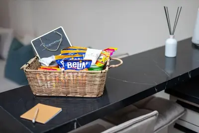 a basket of snacks on a black table at Luxury Studio in Luxury Place in Casablanca