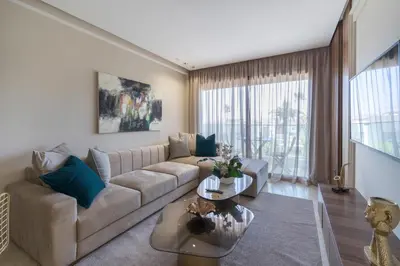 a living room with a couch and a table at Beautiful 1 Bedroom Appartment in Anfa in Casablanca