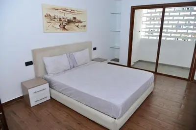a bedroom with a bed and a window at Bel appartement au cœur de rabat in Rabat