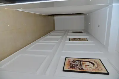 a room with two framed pictures on a white floor at Bel appartement au cœur de rabat in Rabat