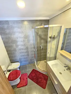 a bathroom with a shower and a toilet and a sink at MIA Appartement N2 - Élégance, Confort et Sérénité in Casablanca
