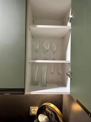a cupboard with wine glasses sitting in it at Studio luxueux bien meublé in Casablanca