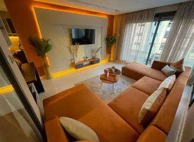 a living room with a couch and a tv at Estay in Casablanca