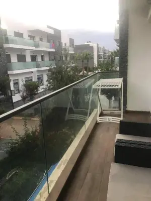 a balcony of a building with a gazebo at Superbe Appartement pieds dans l'eau - Résidence GARDENBAY in Dar Mohammed Ould Haj Jilali