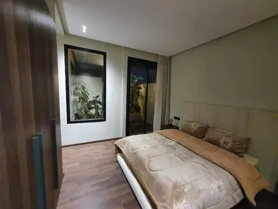 a bedroom with a large bed in a room at Studio élégant in Casablanca