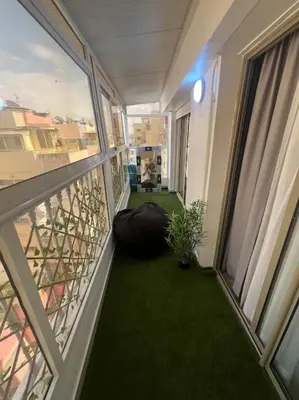 a balcony with a room with green grass at Perfect Studio in Casablanca City Center in Casablanca