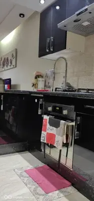 a kitchen with a stove top oven with towels on it at Turner Vision in Casablanca