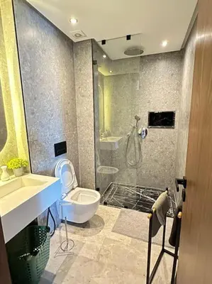 a bathroom with a shower and a toilet and a sink at Studio Monaco in Casablanca