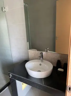 a bathroom with a sink and a mirror at Luxurious Golf Villa with Pool in Bouskoura