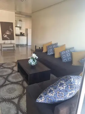 a living room with a couch and a table at Downtown Stay 1Br near Tramway - Parking in Casablanca
