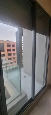 a large glass window in a building with a staircase at Downtown Stay 1Br near Tramway - Parking in Casablanca