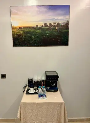 a table with a coffee maker on top of it at Sea view apartment in Casablanca